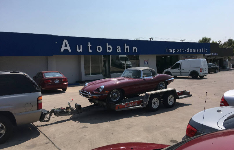 Burgundy Jaguar E-Type Series II Roadster Transported To our Garage